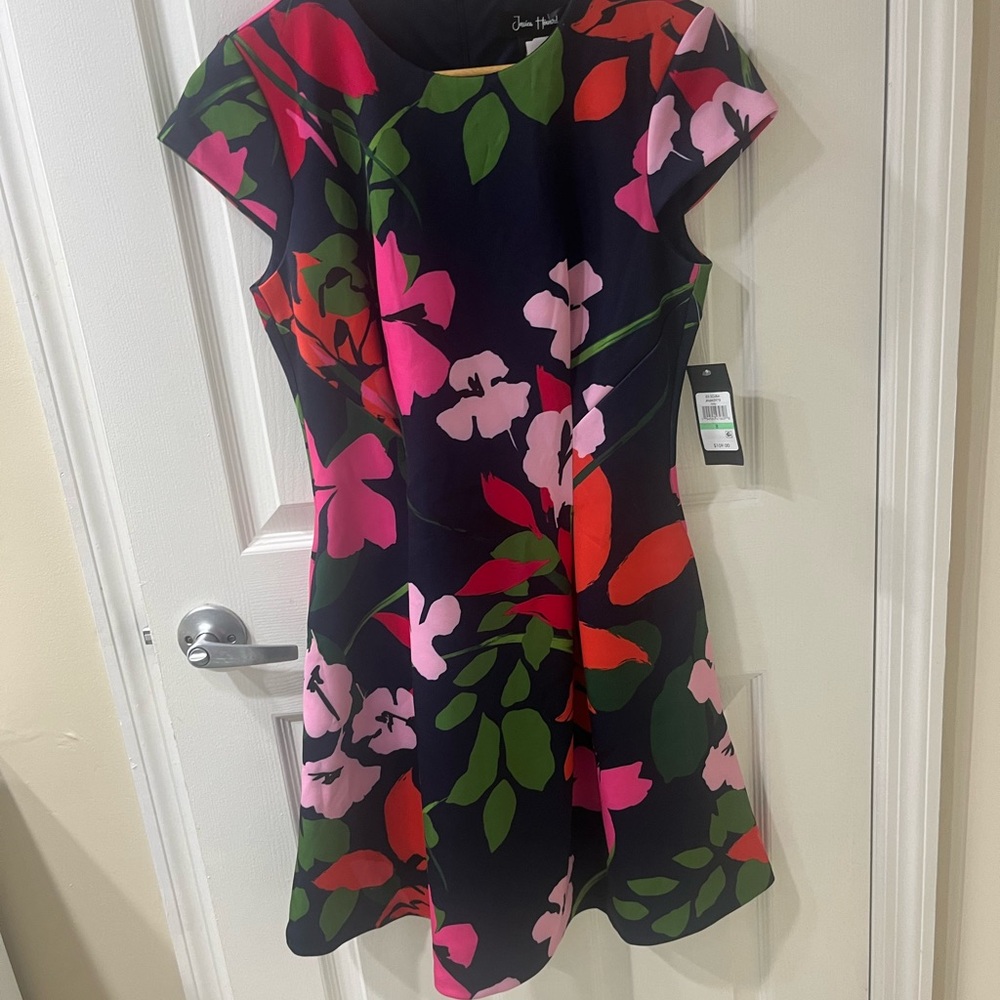 Vibrant colorful floral pattern. This is a lovely dress from Jessica Howard.